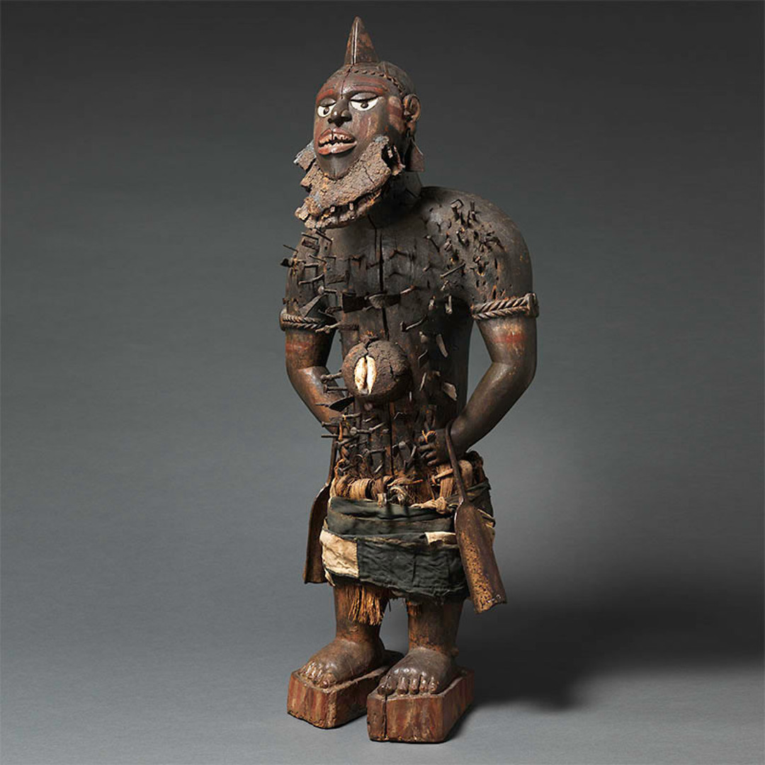 Nkisi wooden power figure with embedded materials