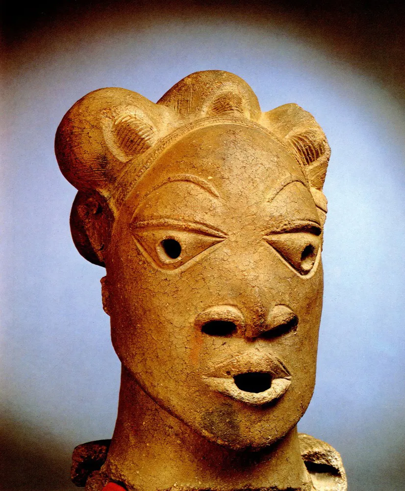 Nok terracotta head with stylised eyes and triangular nose opening
